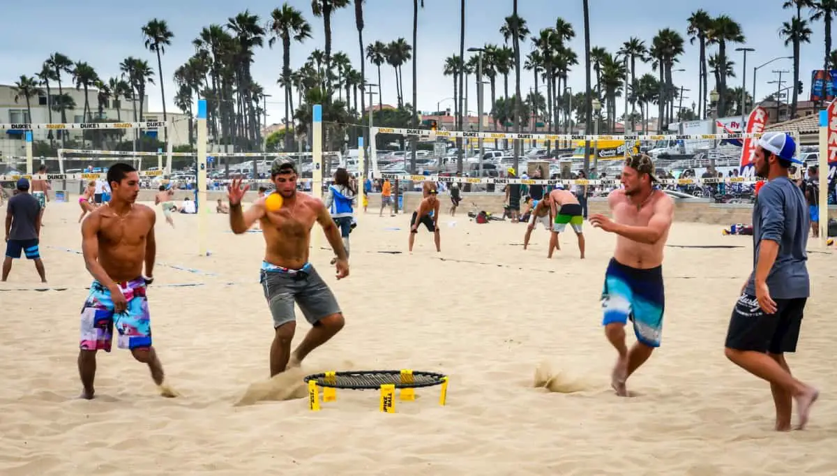 guys playing spikeball on the beach - Best Spikeball Sets