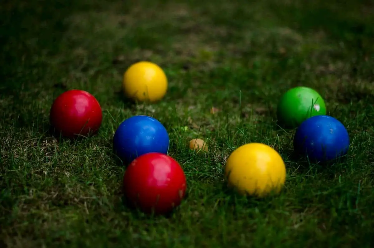 Plastic bocce balls on the grass from our Bocce Ball Buying Guide